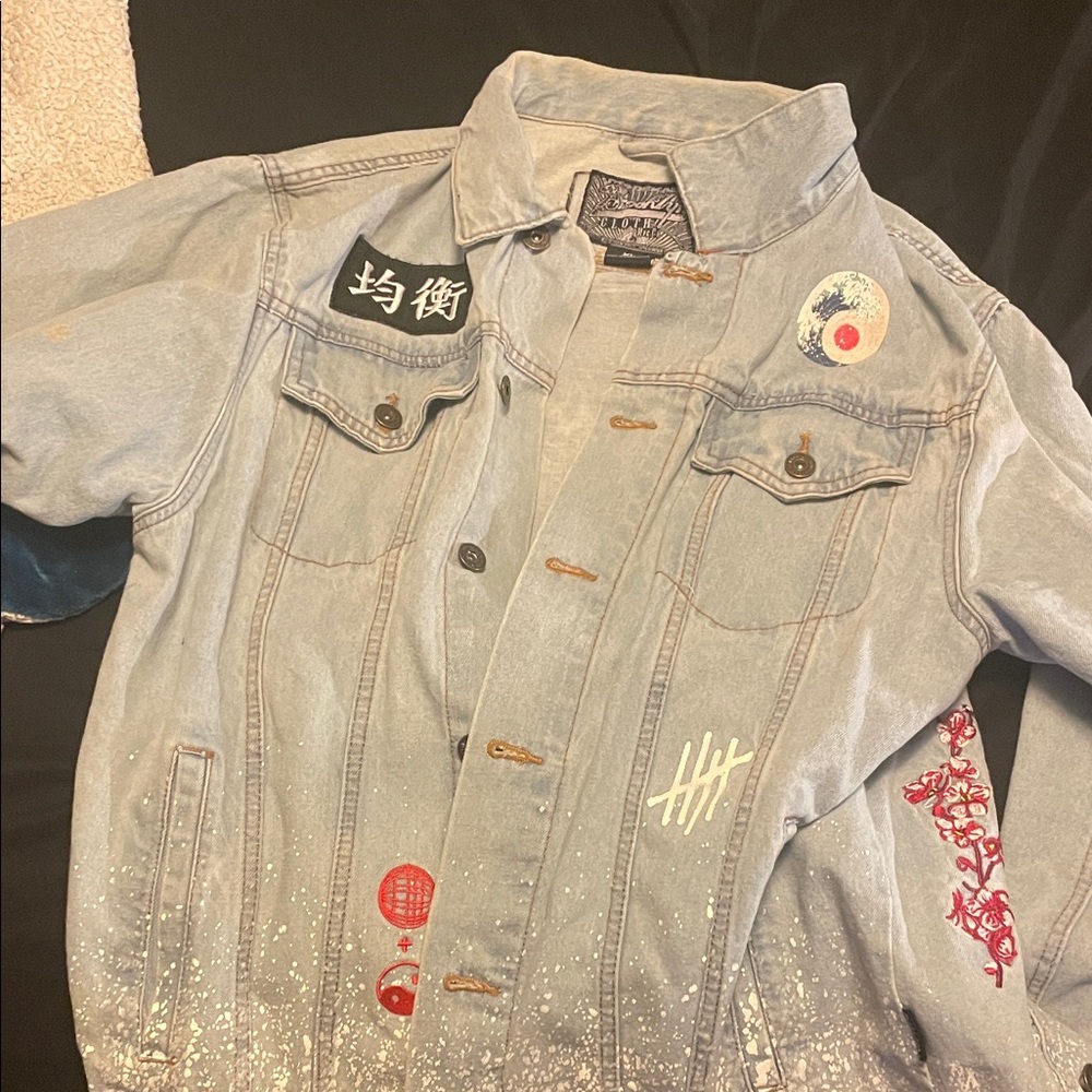 Graphic Denim Jacket with Artistic Design